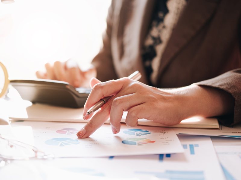 Accountant using a calculator to calculate the numbers. Accounting , Accountancy from financial