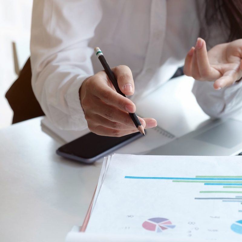 Accountant using a calculator to calculate the numbers. Accounting , Accountancy from financial